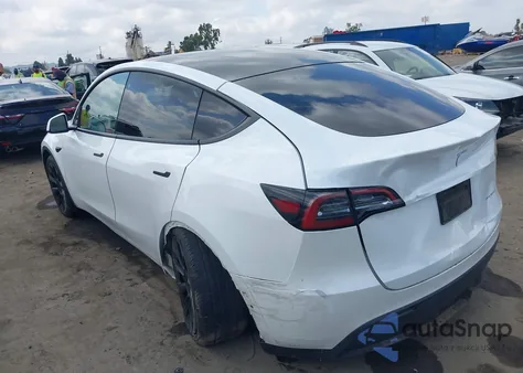 2022 Tesla Model Y из США, поврежденный, VIN 7SAYGDEE1NF386630